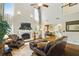 Bright living room featuring high ceilings, a fireplace, and an open concept design to the dining area at 1925 Waters Ferry Dr, Lawrenceville, GA 30043