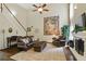 Spacious living room featuring a fireplace, hardwood floors, and comfortable leather furniture at 1925 Waters Ferry Dr, Lawrenceville, GA 30043