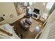 Open concept living room featuring a fireplace, hardwood floors, and a large tapestry at 1925 Waters Ferry Dr, Lawrenceville, GA 30043