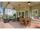 This covered patio features comfortable seating, ceiling fans, and a great place to relax and entertain guests at 1925 Waters Ferry Dr, Lawrenceville, GA 30043