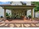 The covered patio features comfortable seating, ceiling fans, and backyard access for relaxing and entertaining at 1925 Waters Ferry Dr, Lawrenceville, GA 30043