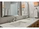 Bright bathroom features a double sink vanity with marble countertop and chrome fixtures at 195 Arizona Ne Ave # 197, Atlanta, GA 30307