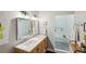 Modern bathroom featuring double sinks, sleek mirrors, and a seamless glass-enclosed shower at 195 Arizona Ne Ave # 197, Atlanta, GA 30307