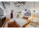 Light-filled bedroom boasts high ceilings, a ceiling fan and a pallet bedframe at 195 Arizona Ne Ave # 197, Atlanta, GA 30307
