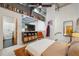 Unique bedroom showcasing a TV, eclectic décor, and storage above the doorway at 195 Arizona Ne Ave # 197, Atlanta, GA 30307