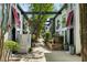 Charming courtyard featuring mature trees, lush landscaping, and access to multiple townhome-style residences at 195 Arizona Ne Ave # 197, Atlanta, GA 30307