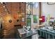 Modern kitchen with a brick wall, stainless steel refrigerator, and sink with bar seating at 195 Arizona Ne Ave # 197, Atlanta, GA 30307