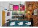 Modern kitchen features a bar with seating, stainless steel appliances, and unique lighting fixtures at 195 Arizona Ne Ave # 197, Atlanta, GA 30307