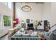 Bright living room boasts exposed brick, modern lighting, and open layout connecting living, dining, and kitchen areas at 195 Arizona Ne Ave # 197, Atlanta, GA 30307