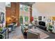 Bright living room features exposed brick, an open floor plan, and abundant natural light at 195 Arizona Ne Ave # 197, Atlanta, GA 30307