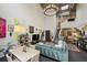 Open living space with a chandelier, second floor loft, and an abundance of natural light at 195 Arizona Ne Ave # 197, Atlanta, GA 30307