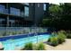 Modern building with a long and narrow community pool and greenery at 195 Arizona Ne Ave # 197, Atlanta, GA 30307