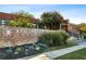 Arizona Lofts brick signage with manicured landscaping at 195 Arizona Ne Ave # 197, Atlanta, GA 30307