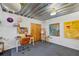 Bright studio space with industrial ceiling, light walls, and an art desk, for the perfect painting area at 195 Arizona Ne Ave # 197, Atlanta, GA 30307