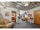 Open studio space with industrial ceiling, seating, and an art desk, for the perfect painting area at 195 Arizona Ne Ave # 197, Atlanta, GA 30307