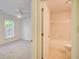 Bedroom next to a clean bathroom featuring a tub/shower combo and tile floors, combining convenience and functionality at 202 Garden Ct, Atlanta, GA 30328