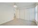 Neutral bedroom featuring plush carpet, a ceiling fan, and double closets, providing ample storage space at 202 Garden Ct, Atlanta, GA 30328