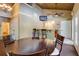 Relaxing clubhouse area with ceiling fan, bar with chairs and dining table and chairs at 202 Garden Ct, Atlanta, GA 30328