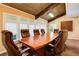 Conference room with wooden table, leather chairs, and vaulted ceiling at 202 Garden Ct, Atlanta, GA 30328