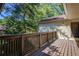 Wooden deck with sturdy railings, perfect for outdoor entertainment and enjoying the backyard's natural scenery at 202 Garden Ct, Atlanta, GA 30328