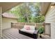 Relaxing outdoor deck with comfortable seating and a view of the surrounding greenery at 202 Garden Ct, Atlanta, GA 30328