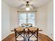 Bright dining area with natural light, ceiling fan, and hardwood floors at 202 Garden Ct, Atlanta, GA 30328