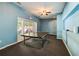Blue walled game room with table tennis and a glass doors leading to outside at 202 Garden Ct, Atlanta, GA 30328