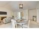 Comfortable living room with a fireplace, dining area, and staircase access at 202 Garden Ct, Atlanta, GA 30328