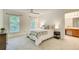 Spacious main bedroom with large windows, ensuite bathroom, and neutral carpet at 202 Garden Ct, Atlanta, GA 30328