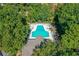Aerial view of a community pool surrounded by lush trees, offering a private retreat at 202 Garden Ct, Atlanta, GA 30328