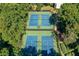 Aerial view of community tennis courts surrounded by lush trees, ideal for recreation and fitness at 202 Garden Ct, Atlanta, GA 30328