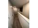 Carpeted hallway with white walls and trim at 30 Barton Ln, Covington, GA 30016