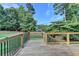 Back deck with railings overlooking a yard with blue skies at 306 Mill Rdg, Canton, GA 30114