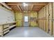 Unfinished basement with painted floor, walls and utility door at 306 Mill Rdg, Canton, GA 30114
