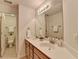 Bathroom with double sinks, granite countertops and a large mirror, with a view into the water closet at 306 Mill Rdg, Canton, GA 30114