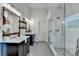 Bright bathroom featuring double vanities, a glass enclosed shower and a freestanding tub at 306 Mill Rdg, Canton, GA 30114