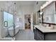 Bright bathroom featuring a freestanding tub, glass enclosed shower, and access to the bedroom at 306 Mill Rdg, Canton, GA 30114
