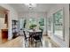Bright breakfast nook with hardwood floors and multiple windows overlooking the backyard at 306 Mill Rdg, Canton, GA 30114