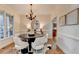 Bright dining room with hardwood floors, neutral decor, and large windows at 306 Mill Rdg, Canton, GA 30114
