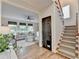 Welcoming entryway with hardwood floors and convenient access to the living areas and stairs at 306 Mill Rdg, Canton, GA 30114