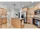 Kitchen with wood cabinets, granite countertops, stainless appliances and kitchen island at 306 Mill Rdg, Canton, GA 30114