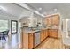 Bright, open kitchen with granite countertops, stainless appliances, and view to eating area at 306 Mill Rdg, Canton, GA 30114