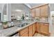 Kitchen with granite countertops, stainless sink and appliances, and wood cabinets at 306 Mill Rdg, Canton, GA 30114