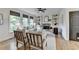 Cozy living room featuring a stone fireplace, built-in shelving, and large windows at 306 Mill Rdg, Canton, GA 30114