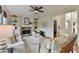 Bright living room with stone fireplace, built-in shelving, and neutral decor with ceiling fan at 306 Mill Rdg, Canton, GA 30114