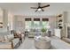 Comfortable living room with hardwood floors, built-in shelving, and three bright windows at 306 Mill Rdg, Canton, GA 30114