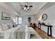 Spacious main bedroom with a tray ceiling, hardwood floors, and serene ambiance at 306 Mill Rdg, Canton, GA 30114