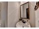 Stylish powder room with a modern vanity, framed mirror, and elegant decor at 306 Mill Rdg, Canton, GA 30114