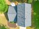 Aerial view of the house with a well maintained roof and lush, green surrounding lawns at 1612 Silver Oak Dr, Austell, GA 30106