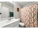 Bathroom featuring floral shower curtain and vanity at 1612 Silver Oak Dr, Austell, GA 30106